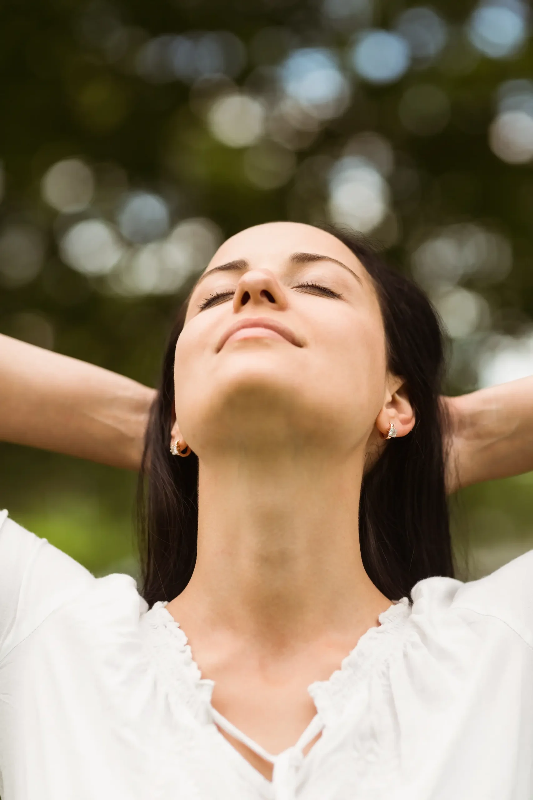 brunette-enjoying-nature-with-her-hands-behind-hea-2025-04-03-21-30-35-utc