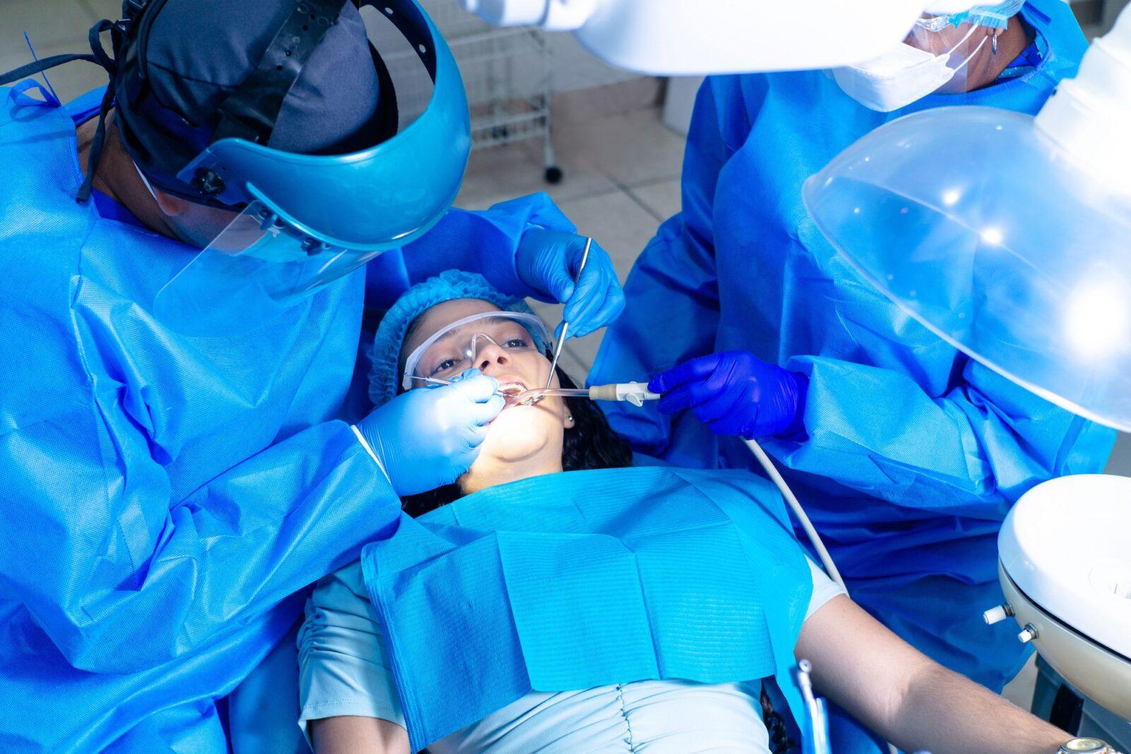 dentists-doing-endodontics-on-a-female-patient-with-brackets